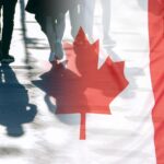 The National Flag of Canada and shadows of people, concept picture